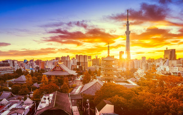 Autumn view of Senso-ji Temple and skytree with dramatic sky at dawn in Tokyo, Japan