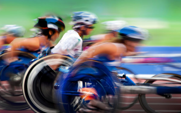 finishing spurt Paralympic wheelchair in motion at the stadium