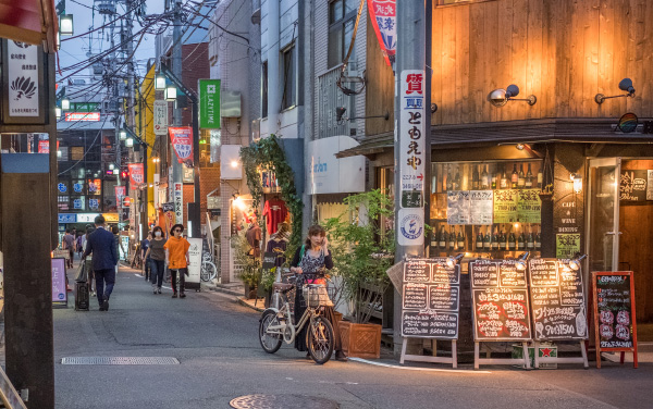 TOKYO, JAPAN - JULY 1ST, 2017. People in the street of Shimokitazawa district. This Tokyo neighborhood is known for small independent fashion retailers, cafes and entertainment venues.