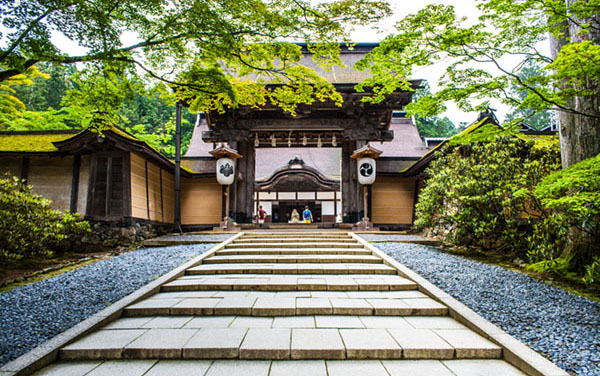 An entrance to a mountain Buddhist shrine. Koyasan`s most famous Kongobuji Temple. Head temple of Shingon Buddhism, located on Mount Koya in Japan. Part of UNESCO World Heritage Site.